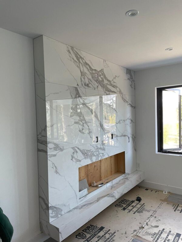 Slab sections dry-laid to match veining across a fireplace hearth