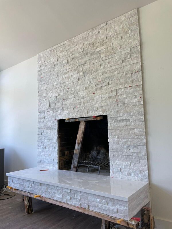 Floating hearth slab being supported and levelled during installation