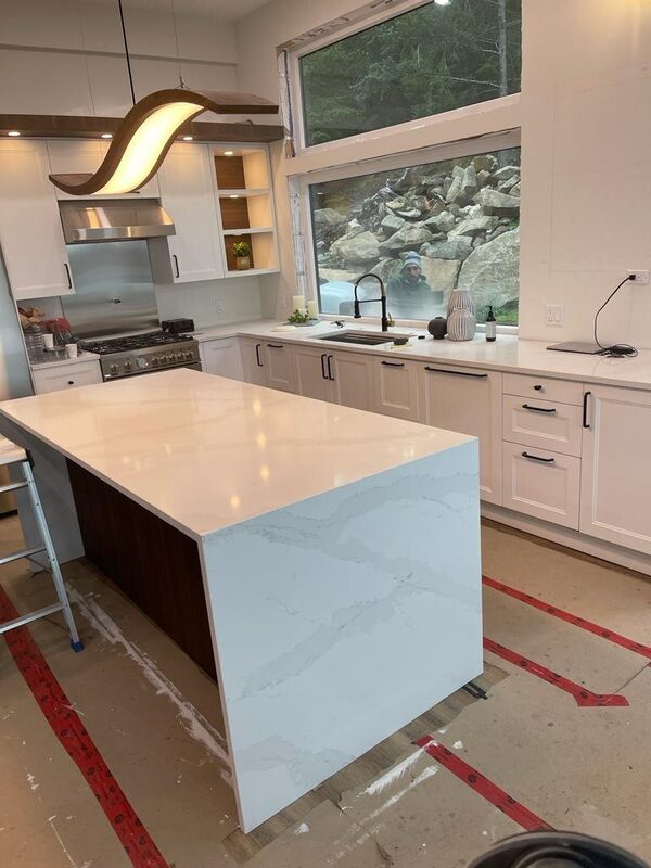 Mitred waterfall island edge freshly set with the floor still under protection