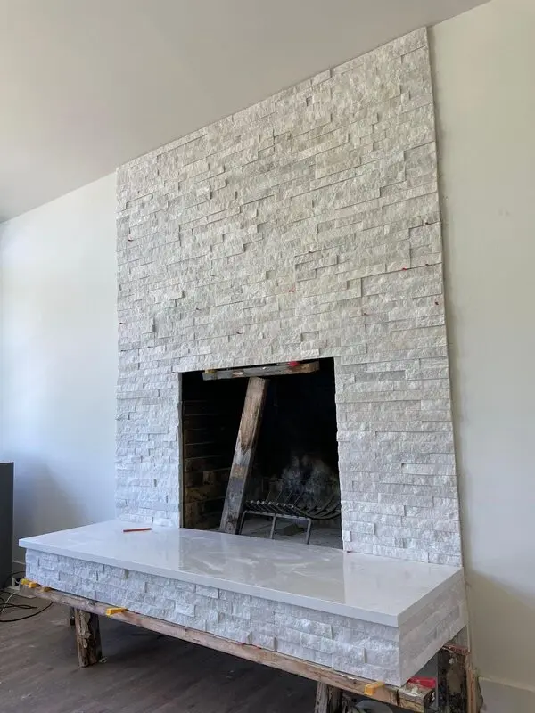 Floating hearth slab being supported and levelled during installation